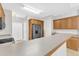 Kitchen area showcasing counter seating and updated appliances, including a stainless steel refrigerator at 103 Kylie Savannah Ct, Cary, NC 27511