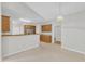 Spacious kitchen featuring ample cabinet space and an eating area with neutral walls and flooring at 103 Kylie Savannah Ct, Cary, NC 27511