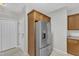 Kitchen area showcasing stainless steel refrigerator and plenty of cabinet space for organized storage solutions at 103 Kylie Savannah Ct, Cary, NC 27511