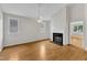 Living room with hardwood floors, fireplace, and vaulted ceilings at 103 Kylie Savannah Ct, Cary, NC 27511
