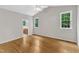 Bedroom featuring hardwood floors and multiple windows for lots of natural light at 103 Kylie Savannah Ct, Cary, NC 27511