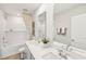 Modern bathroom featuring a double sink vanity and a shower-tub combo at 1037 Winding Spring Dr, Mebane, NC 27302