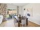 Elegant dining area with stylish chairs, modern art, and sliding glass doors to the patio at 1037 Winding Spring Dr, Mebane, NC 27302