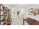 Upstairs hallway is spacious and leads to multiple rooms, with wood shelving decor and carpeted floors at 1037 Winding Spring Dr, Mebane, NC 27302