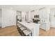 Modern kitchen with a large island featuring white countertops and stainless-steel appliances at 1037 Winding Spring Dr, Mebane, NC 27302