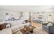 Open-concept living area with modern furniture, a large sectional sofa, and a view into the kitchen at 1037 Winding Spring Dr, Mebane, NC 27302