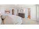 Bright main bedroom with a dresser and decor and access to a Primary bath and walk-in closet at 1037 Winding Spring Dr, Mebane, NC 27302