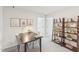 Bright office space features a desk with decor and a decorative wood shelving unit against the wall at 1037 Winding Spring Dr, Mebane, NC 27302