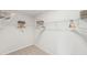 Spacious walk-in closet with ample storage space, metal racks, and natural light at 1037 Winding Spring Dr, Mebane, NC 27302