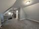 Spacious attic space featuring neutral walls and carpeted floors with access to other levels at 108 W Marsha Gayle Ct, Fuquay Varina, NC 27526