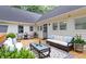 Back deck featuring an outdoor seating area with stylish furniture and decor at 108 W Marsha Gayle Ct, Fuquay Varina, NC 27526