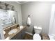 Clean bathroom featuring a vanity with a granite countertop and a shower-tub combo at 108 W Marsha Gayle Ct, Fuquay Varina, NC 27526