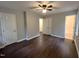 Spacious bedroom with hardwood floors and multiple closets, plus ensuite bath at 108 W Marsha Gayle Ct, Fuquay Varina, NC 27526