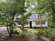Charming front exterior view of a home with mature landscaping and a welcoming entrance at 108 W Marsha Gayle Ct, Fuquay Varina, NC 27526