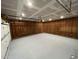A view of the spacious garage, freshly painted with exposed framing at 108 W Marsha Gayle Ct, Fuquay Varina, NC 27526