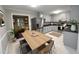 Well-lit eat-in kitchen featuring stainless steel appliances, white cabinets, and ample counter space at 108 W Marsha Gayle Ct, Fuquay Varina, NC 27526