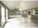 Bright living room with many windows, tile flooring and rear deck access at 108 W Marsha Gayle Ct, Fuquay Varina, NC 27526