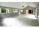 Spacious living room featuring vaulted ceilings, large windows, and tiled floor at 108 W Marsha Gayle Ct, Fuquay Varina, NC 27526