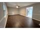 Living room featuring wood-look floors, neutral walls, white trim, and a ceiling fan at 108 W Marsha Gayle Ct, Fuquay Varina, NC 27526