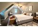 Comfortable main bedroom with an angled ceiling, neutral tones, and carpet flooring at 108 W Marsha Gayle Ct, Fuquay Varina, NC 27526