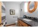 Tastefully decorated bathroom boasts a granite countertop vanity and gray accent wall at 109 Loch Haven Ln, Cary, NC 27518