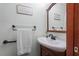 Bathroom featuring a single sink vanity, framed mirror, updated fixtures, and a neutral color palette at 109 Loch Haven Ln, Cary, NC 27518