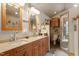 Elegant bathroom featuring double sinks, and a walk-in shower at 109 Loch Haven Ln, Cary, NC 27518