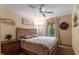 Neutral bedroom features a patterned bedspread, light-colored walls, and outdoor views at 109 Loch Haven Ln, Cary, NC 27518
