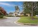 Attractive building exterior is framed by lush landscaping and a winding driveway at 109 Loch Haven Ln, Cary, NC 27518