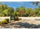 Lochmere Golf Club entrance sign surrounded by beautiful landscaping and trees at 109 Loch Haven Ln, Cary, NC 27518