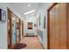 Bright foyer with tile flooring, skylight and artistic details on the walls and custom glass doors at 109 Loch Haven Ln, Cary, NC 27518