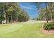 Picturesque golf course fairway lined with mature trees at 109 Loch Haven Ln, Cary, NC 27518