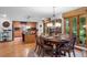 A transitional kitchen features a center island, wood cabinets, granite countertops, and stainless steel appliances at 109 Loch Haven Ln, Cary, NC 27518