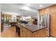 This open-concept kitchen has an island with a countertop and stainless steel appliances at 109 Loch Haven Ln, Cary, NC 27518