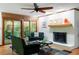 Relaxing living room features a fireplace, and access to the outdoor patio, creating a cozy and inviting space at 109 Loch Haven Ln, Cary, NC 27518
