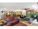 Open-concept living and dining areas featuring hardwood floors, natural light, and comfortable furnishings at 109 Loch Haven Ln, Cary, NC 27518