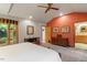 Cozy main bedroom with hardwood floors, a ceiling fan, and a view of the outdoors at 109 Loch Haven Ln, Cary, NC 27518