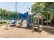 Brightly colored playground with slides and climbing features sits nestled in a wooded common area at 109 Loch Haven Ln, Cary, NC 27518