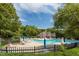 Expansive community pool with multiple swimming areas surrounded by ample lounge seating at 109 Loch Haven Ln, Cary, NC 27518