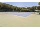 Outdoor tennis courts with green and blue surfaces, surrounded by lush greenery at 109 Loch Haven Ln, Cary, NC 27518