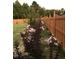 Well-maintained backyard with a wooden fence and tasteful landscaping for added privacy and charm at 1116 Powder, Fuquay Varina, NC 27526