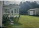 Backyard view with screened in porch, storage shed and lush green lawn at 1116 Powder, Fuquay Varina, NC 27526