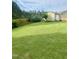 Large, well-manicured backyard with ample green space and privacy fence at 1116 Powder, Fuquay Varina, NC 27526