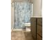 Bathroom featuring a shower with decorative curtain and neutral color palette at 1116 Powder, Fuquay Varina, NC 27526