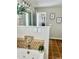Bathroom with jacuzzi tub with mosaic tile and updated faucet at 1116 Powder, Fuquay Varina, NC 27526