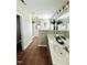 Bright bathroom with double sinks, tile flooring, and framed mirrors at 1116 Powder, Fuquay Varina, NC 27526