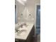 Bathroom with double vanity, framed mirror, and neutral color palette at 1116 Powder, Fuquay Varina, NC 27526
