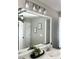 Bathroom vanity featuring a framed mirror, modern lighting, and decor at 1116 Powder, Fuquay Varina, NC 27526