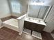 Bathroom with soaking tub, double sink vanity, and tiled floor at 1116 Powder, Fuquay Varina, NC 27526