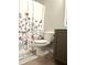 Bathroom featuring a toilet and decorative curtain and neutral color palette at 1116 Powder, Fuquay Varina, NC 27526